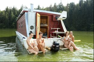 A gang of teen chicks go rafting on a sea in the bare